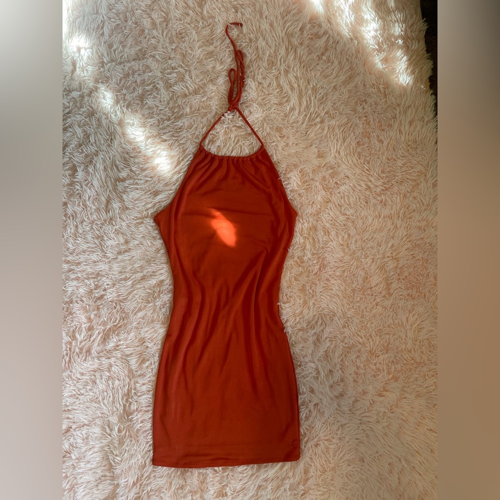 Deep orange backless dress.